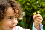Potty training toddlers while homeschooling, small child with flower image